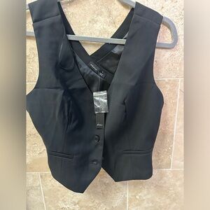 Black stylish vest with crisscross back. Size M